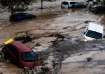 Cars are being swept away by the water, after floods