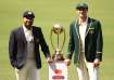 Rohit Sharma and Pat Cummins with the BGT trophy.