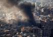 Thick smoke rises over Beirut's southern suburbs from a