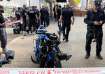 Israeli police stand around the motorbike of the attacker