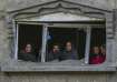 Palestinians look at the destruction site