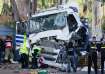 Israeli police and rescue services inspect the site where a truck driver rammed into a bus stop near