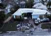 A drone view shows buildings and structures damaged by