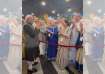 Russian nationals sing Krishna Bhajan before Prime Minister Narendra Modi, as they welcome him to Ka