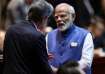 Prime Minister Narendra Modi speaks to U.S. Secretary of State Antony Blinken as they attend the 19