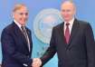 Pakistan Prime Minister Shehbaz Sharif shakes hand with Russian President Vladimir Putin on the side