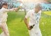 Joe Root celebrates with Alastair Cook.