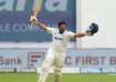 Sarfaraz Khan celebrates his maiden Test century.