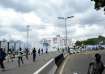 People run away from tear gas during a protest on the