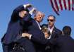 Republican presidential candidate former President Donald Trump is surrounded by US Secret Service a