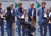 Indian chess player touches Magnus Carlsen's feet.