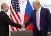 Russia's President Vladimir Putin shakes hands with then US President Donald Trump during a meeting 