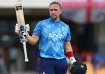 Liam Livingstone celebrates his hundred against West Indies.