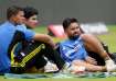 Rishabh Pant sitting alongside Yashasvi Jaiswal and Shubman Gill on the sidelines of a practice sess