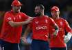 Saqib Mahmood celebrates a wicket with teammates Jamie Overton and Phil Salt.