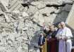 Mosul and Aqra Archbishop Najib Mikhael Moussa, left, waves as he stands next to Pope Francis at the