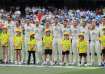 Australian players lined up for their national anthem.