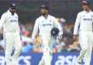 Rohit Sharma, Rishabh Pant and Yashasvi Jaiswal go off the field as rain falls at the Gabba.