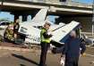 First responders work the scene after a plane crashed on a highway 