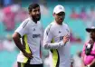 Jasprit Bumrah with a support staff member.