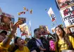 People react as they watch broadcast of the release of Israeli soldier Agam Berger.