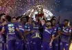 KKR with IPL trophy.