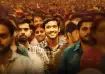Vikrant Massey smiling in a crowded frame from the movie 12th Fail, symbolising hope and resilience 