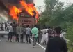 Bystanders around the bus which crashed with a motorcycle