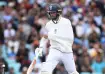 Chris Woakes, with his left arm in a sling, inside his
