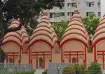 Dhakeshwari Temple in Old Dhaka showcasing red brick architecture and terracotta carvings