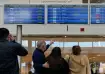Travellers check departure times as many flights are
