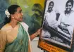 Asha Bhosle with Lata Mangeshkar's portrait 