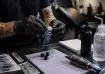 Tattoo artist preparing equipment in studio