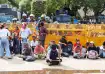 People sit at the protest site at Jantar Mantar supporting