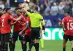 Egypt players are arguing with the referee