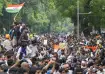 Students raise slogans during a protest march at Sansad
