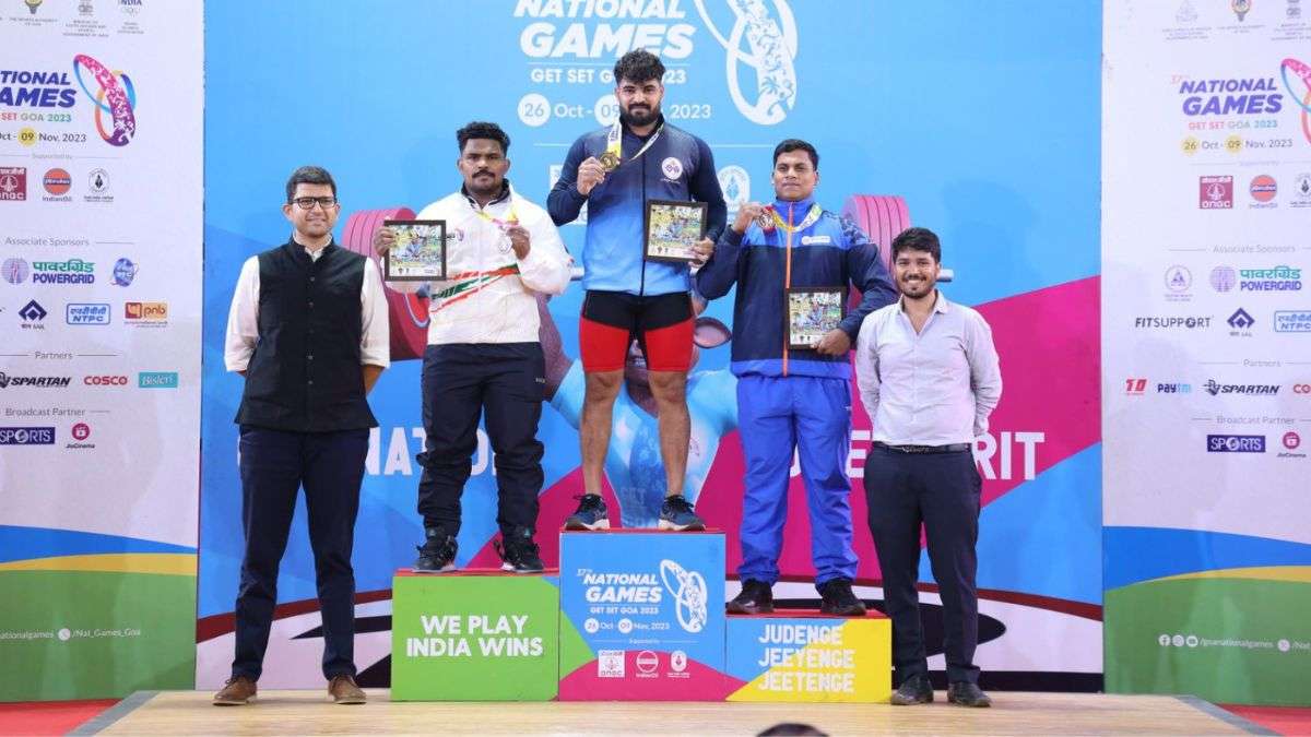 Medal winners of the Men's 96 kg weightlifting event on Oct