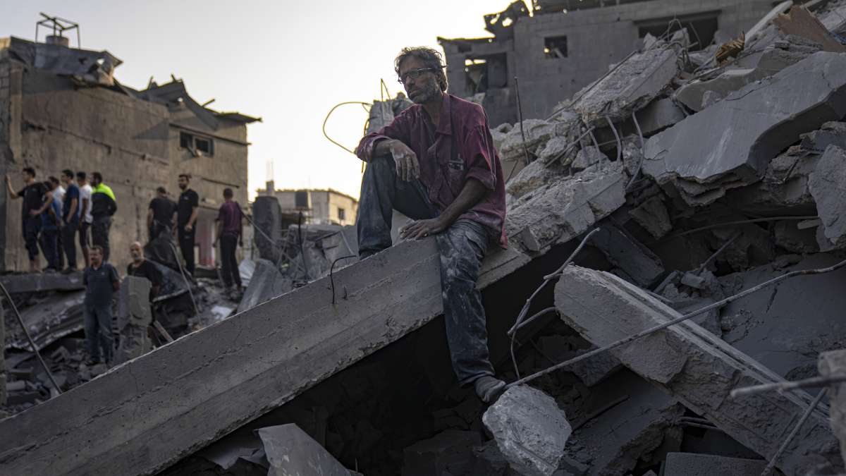 A helpless man sitting on the rubles after losing his family in Israeli bombardment in Gaza. 