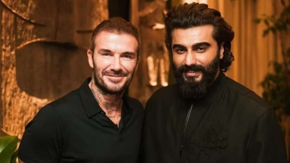 Did Arjun try to look tall while posing with David Beckham?
