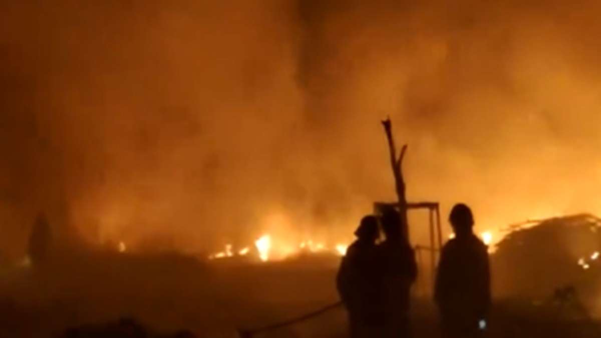 A warehouse in Delhi's Fatehpur region engulfs in flames.