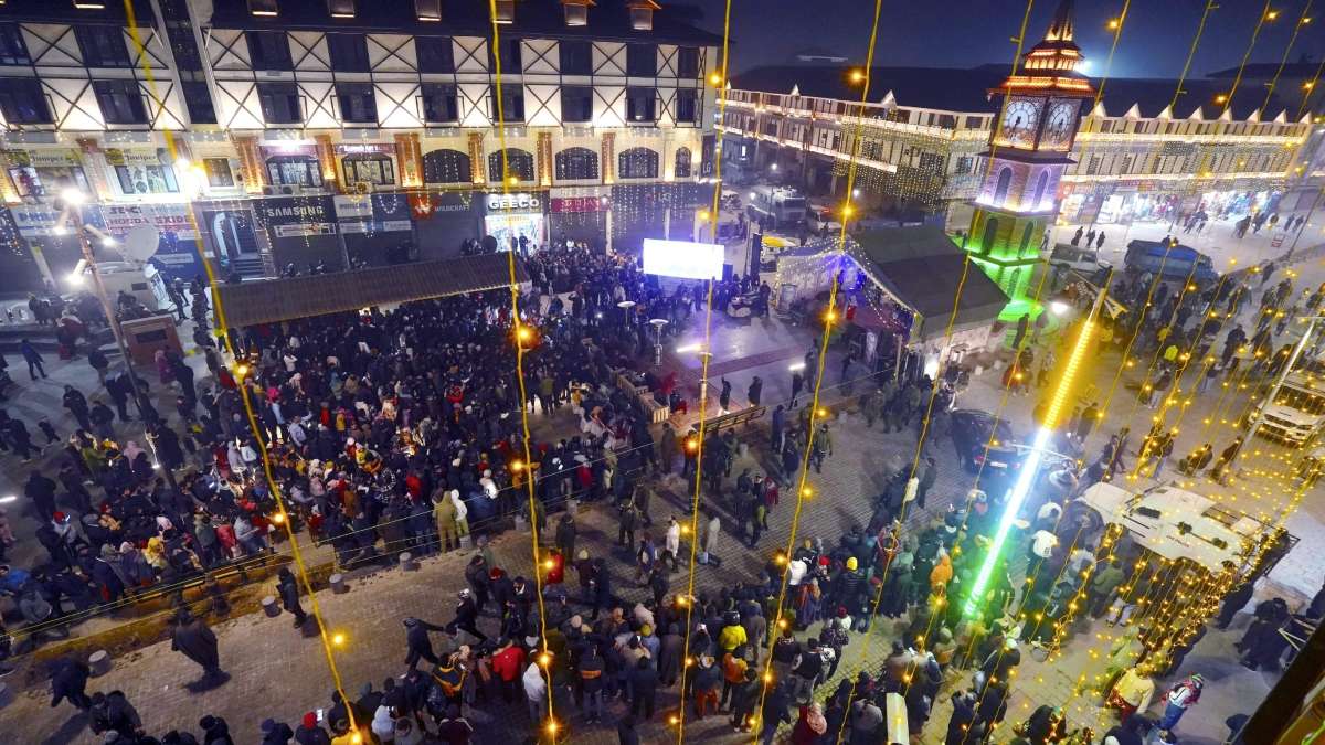People gather at the clock tower Lal Chowk to attend a