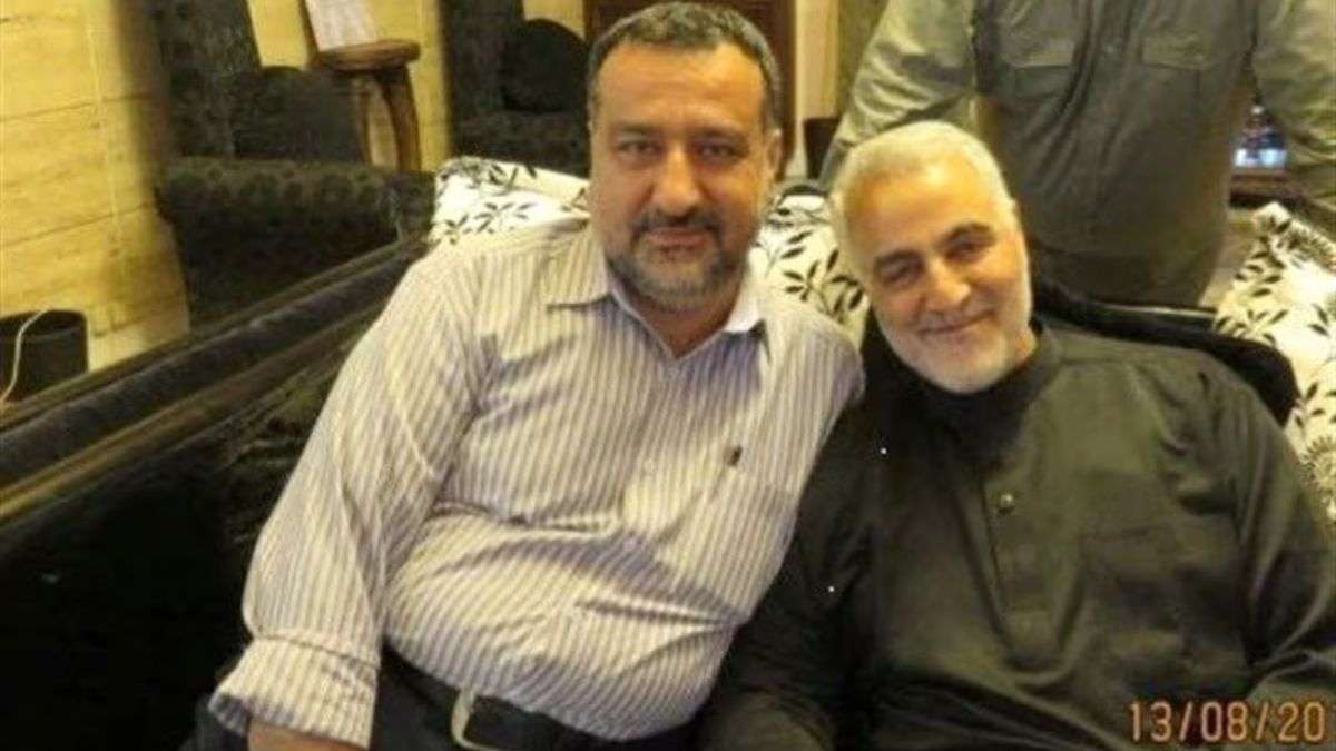 Senior adviser for Iran's Islamic Revolutionary Guard Corps, Sayyed Razi Mousavi, sits next to late 