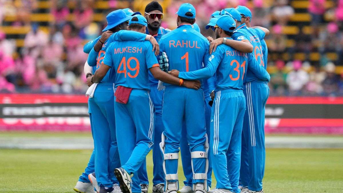 Indian team in a huddle.