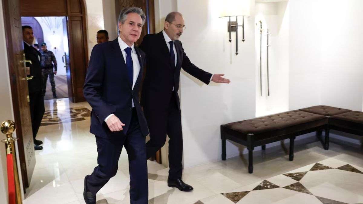 US Secretary of State Antony Blinken walks with Jordanian Foreign Minister Ayman Safadi in Amman, Jo