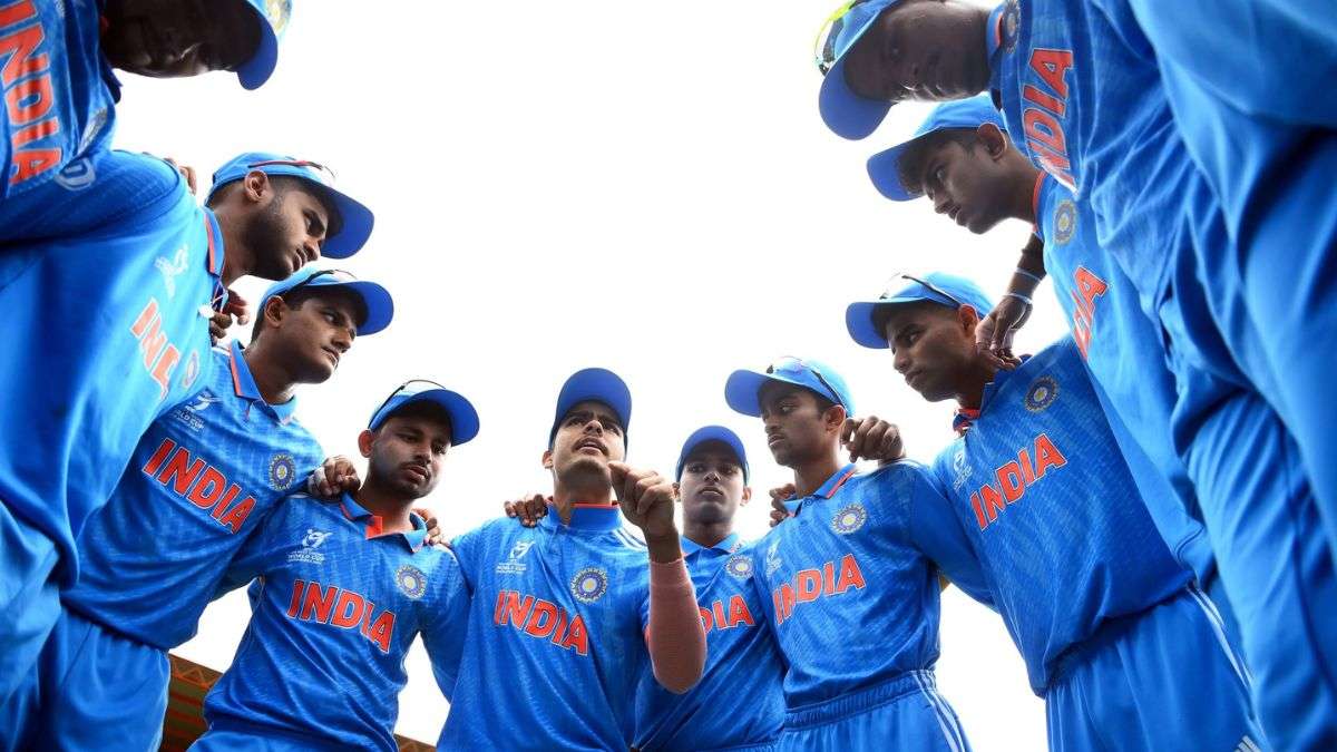 Indian U19 Men's Cricket Team in a huddle.