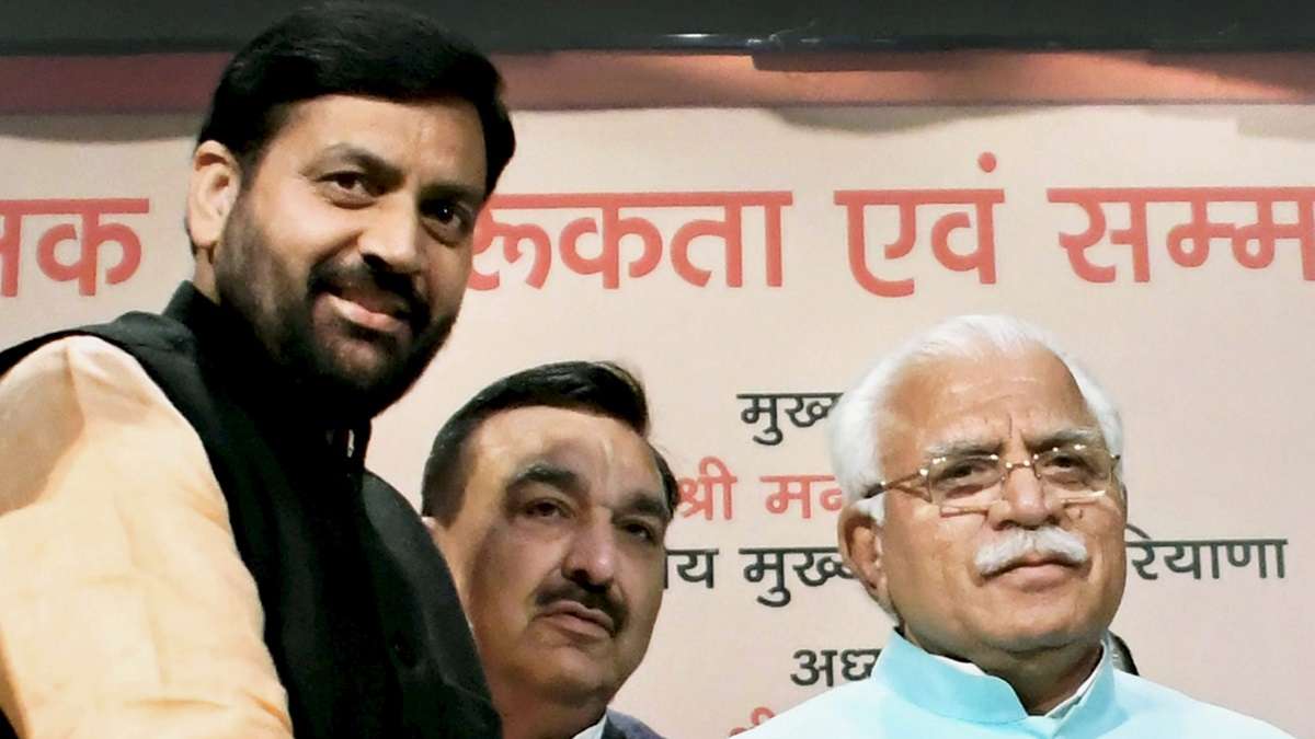 Haryana's new CM Nayab Saini (left) with former CM Manohar