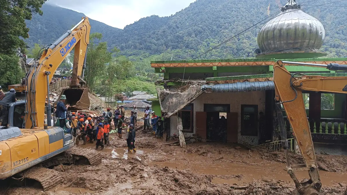 Rescuers search for victims after a landslide that killed a number of people and left some others mi