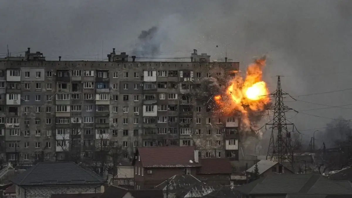 An explosion erupts from an apartment building at 110 Mytropolytska St., after a Russian army tank f