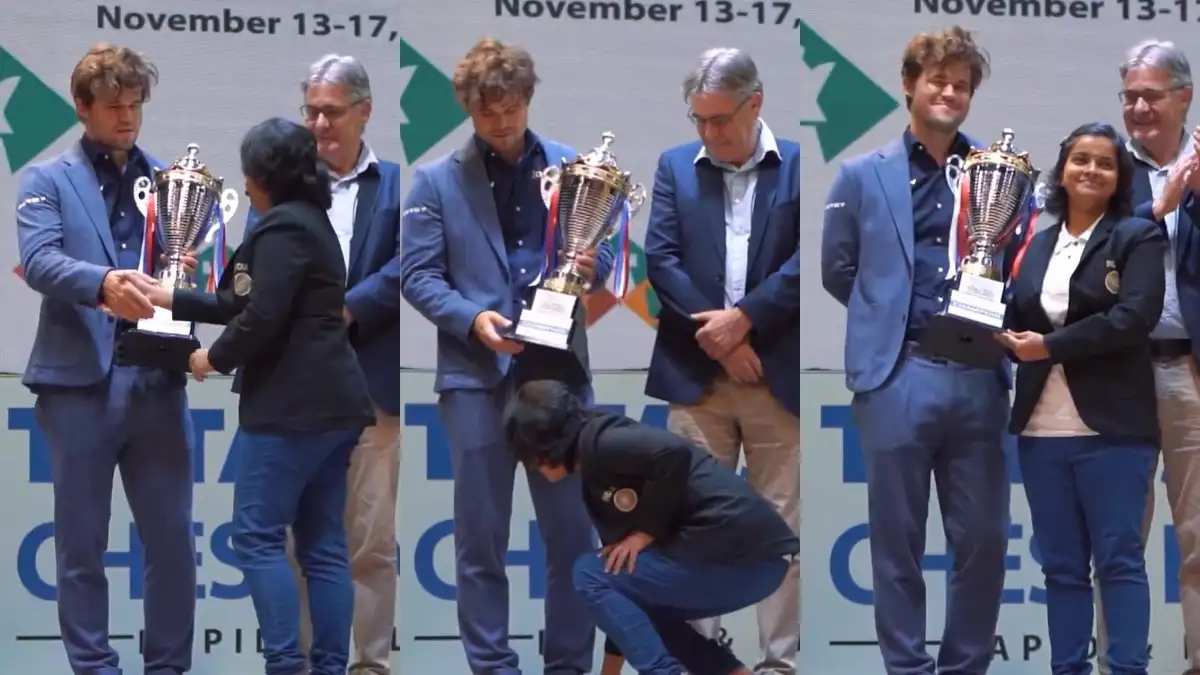 Indian chess player touches Magnus Carlsen's feet.