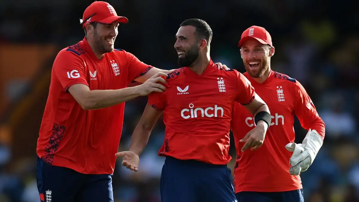 Saqib Mahmood celebrates a wicket with teammates Jamie Overton and Phil Salt.